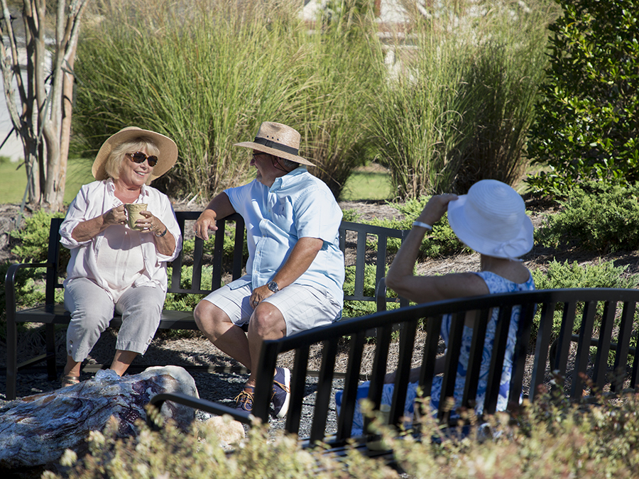 Neighbors enjoying coffee together in the morning sun.>